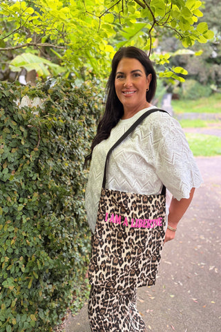 Bianca carrying the free leopard I AM A LIBERTINE tote with the Sahara Barrel Jeans in Leopard — Libertine The Label