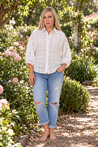 Evana wearing the Lark Blouse in Coconut embroidery in the garden — Libertine The Label