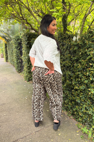 Back view of the Sahara Barrel Jeans in Leopard on Bianca, showing the elastic back waist, patch back pockets and barrel leg — Libertine The Label