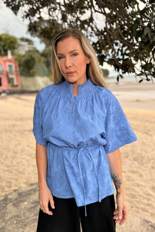 Evana in the Dylan Blouse in Cornflower, tied at the waist for a little shape — Libertine The Label