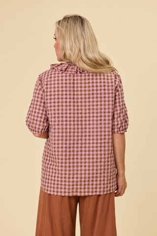 Back view of the Poet blouse in marshmallow and choc latte seersucker cotton, showing the wide bell sleeves and soft drape through the body.