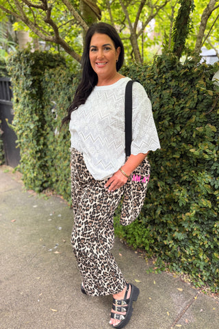 Bianca in the Sahara Barrel Jeans in Leopard with the Luna Top in Coconut broderie and the free leopard I AM A LIBERTINE tote — Libertine The Label