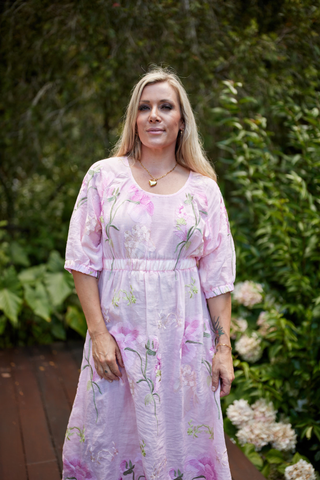 Evana in the Devotion Dress in Marshmallow, front view showing the scooped neckline and elasticated empire waist — Libertine The Label