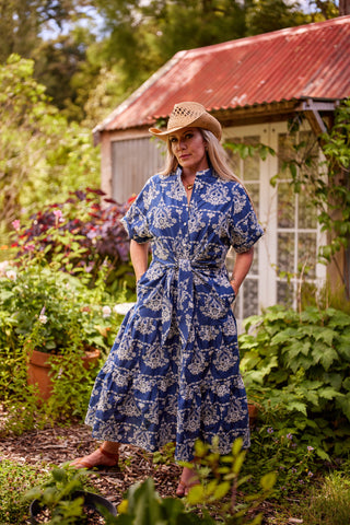 Holiday Dress in indigo cotton with all-over cream embroidery, tie waist and tiered skirt — Libertine The Label