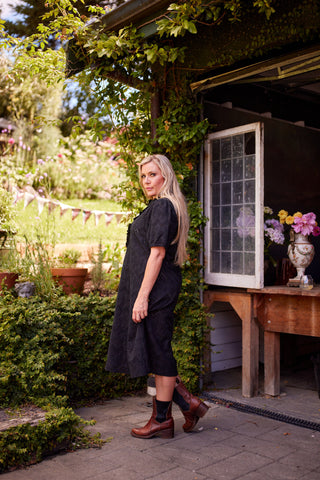 Belle Dress in black broiderie, side pocket detail — Libertine The Label