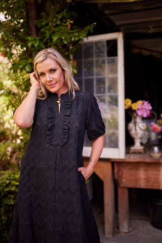 Belle Dress in black cotton broiderie anglaise, ruffled V-neck and puff sleeves, full A-line midi — Libertine The Label
