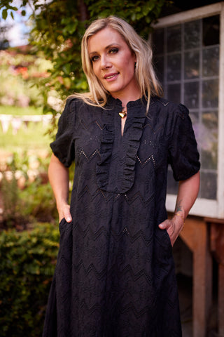 Belle Dress in black broiderie, back view — Libertine The Label