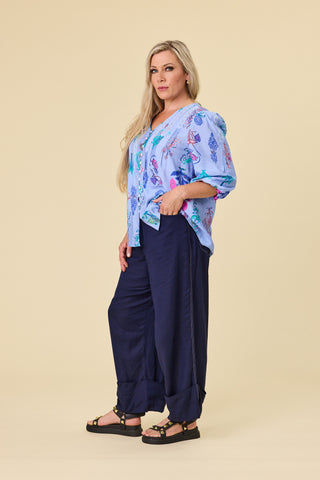 Evana wearing the Atlas Blouse in Sky botanical, sleeves gently elasticated below the elbow — Libertine The Label