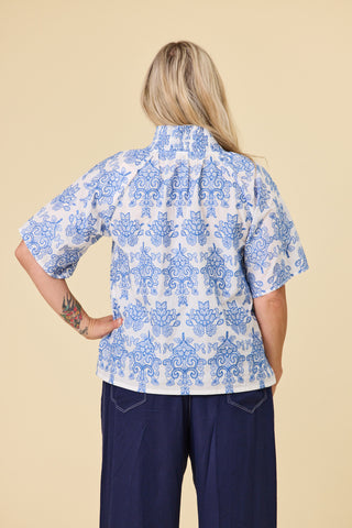 Evana, NZ size 12, wearing the Dylan Blouse in Cornflower embroidery, loose through the body — Libertine The Label