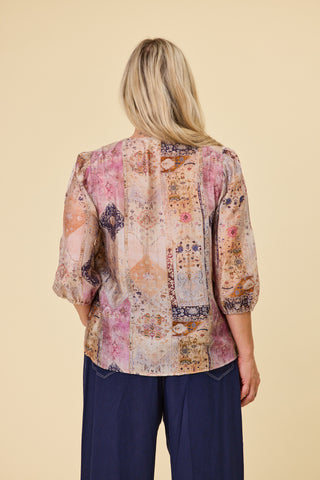 Evana wearing the Atlas Blouse in Mirage print, sleeves gently elasticated below the elbow — Libertine The Label