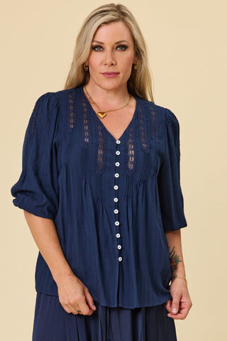 Evana wearing the Atlas Blouse in Indigo Jacquard with crochet lace V-neck and pintucks — Libertine The Label
