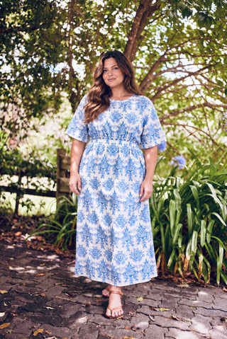 Jorja, NZ size 16, wearing the Devotion Dress in Cornflower in our size L, Libertine The Label