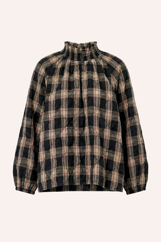 Plaid shirt with a high collar on a beige background
