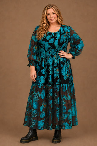 woman in teal burn out velvet dress
